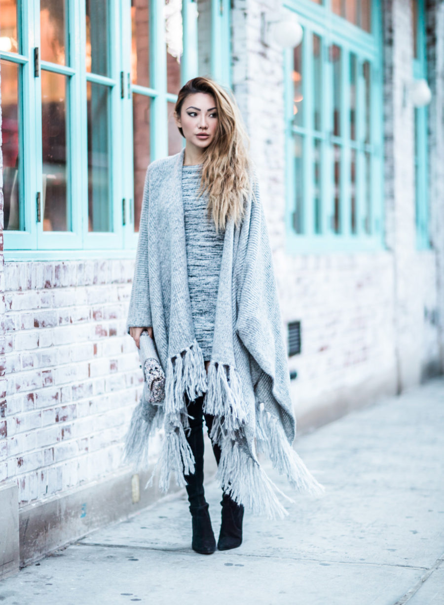 fashion blogger jessica wang wears a sweater dress with stuart weitzman over the knee boots and a fringe poncho // Notjessfashion.com