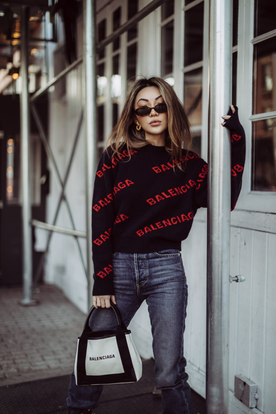 Best outfits for in-between weather - Balenciaga Logo Sweater, Balenciaga Tote, Dakar Boots, sweater and boots outfit // Notjessfashion.com