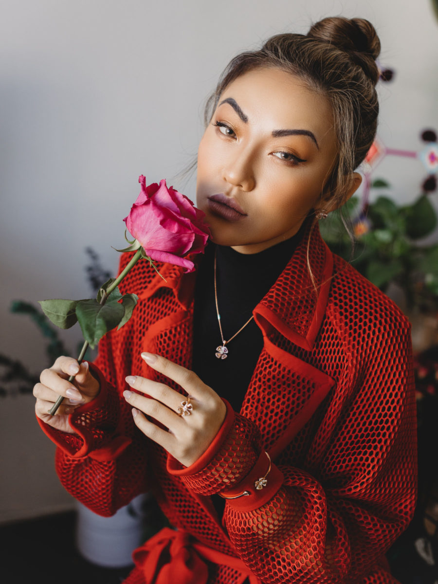Jessica Wang wearing a red mesh trench and a black turtleneck shirt while sharing her favorite crowd pleasing gifts from amazon // Jessica Wang - Notjessfashion.com