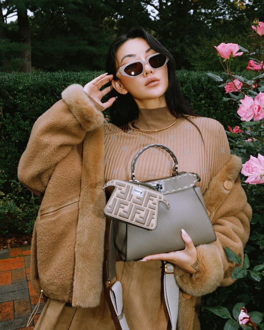 Jessica Wang wearing a fur coat, a turtleneck shirt, and corduroy skirt with a fendi peekaboo bag and fendi sandals while sharing her favorite fall and winter handbags for 2021 // Jessica Wang - Notjessfashion.com