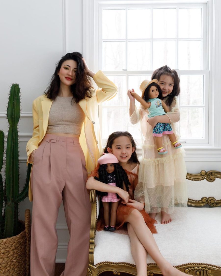 Jessica Wang wearing a light yellow blazer with a crop top and high waisted pants for family photo outfits // Jessica Wang - Notjessfashion.com