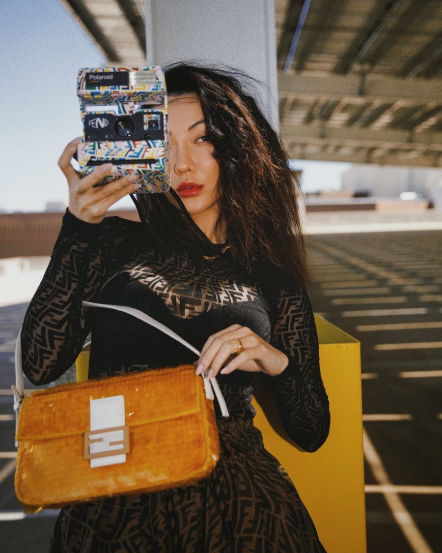 Jessica Wang wearing a mesh fendi top with fendi shorts and a polaroid instant camera while sharing her favorite crowd pleasing gifts from amazon // Jessica Wang - Notjessfashion.com