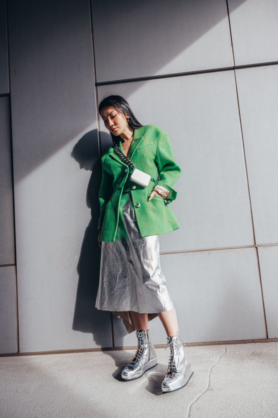 Jessica Wang wearing a green blazer with a silver skirt while sharing cute winter outfits // Jessica Wang - Notjessfashion.com